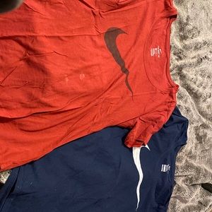 red and blue nike tshirts